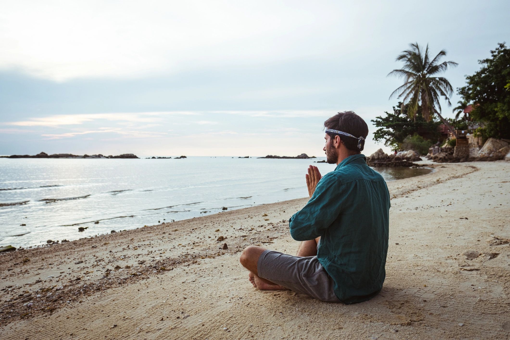 Man meditating by the sea